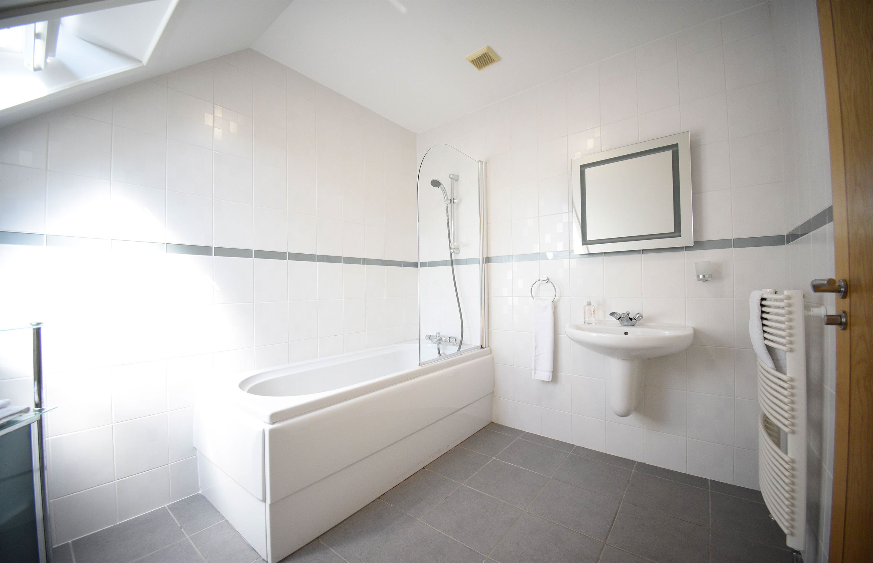 Smiddy Croft Bed and Breakfast accommodation in Broadford contains an en suite bathroom with shower and heated towel rail